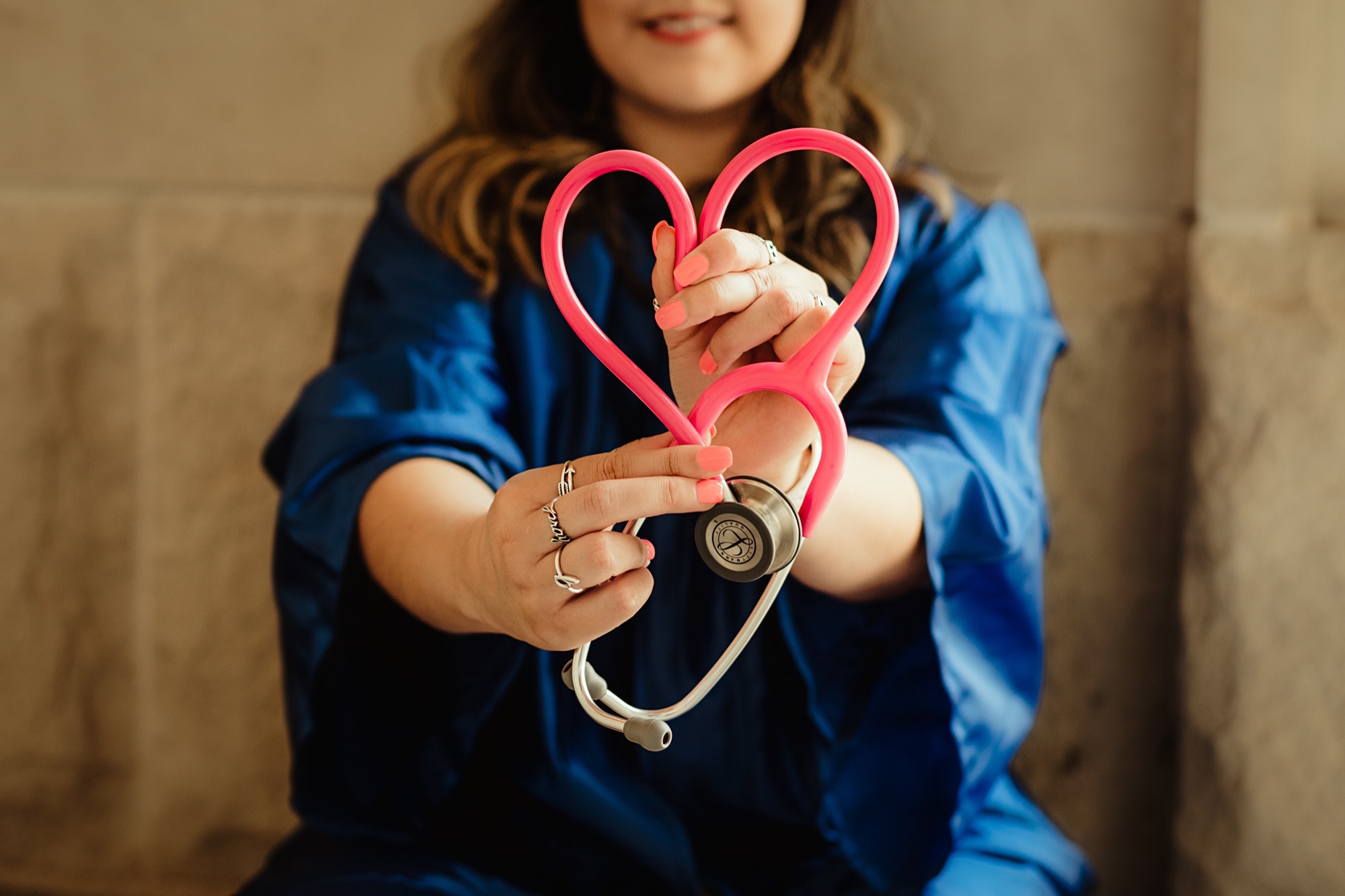 Nurse holding a heart-shaped stethoscope